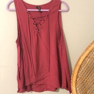 Dark pink shirt with lace up detail in front
